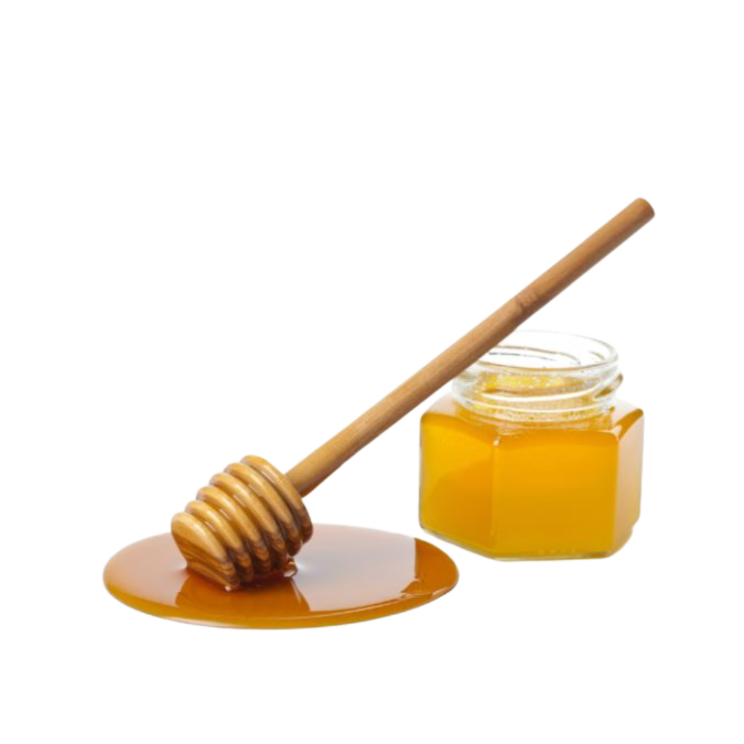Honey jar with dipper and spilled honey on a white background.